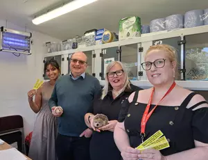 Representatives from Love Solihull, Cllr Mackiewicz, Solihogs and Veolia stood in front of hedgehog containers at Solihogs
