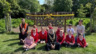 The Mayor of Solihull, Shameena Villars from the Love Solihull team, and Lewis Hayden, service delivery manager for Veolia just before cutting the ribbon on Bentley Heath bug hotel.